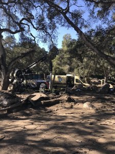 Combo trucks working in Montecito for mudslide cleanup